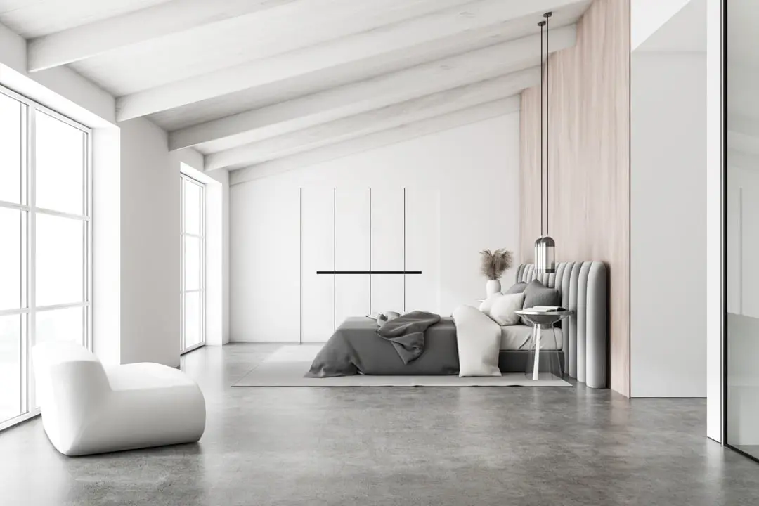 Bedroom in luxury villa with grey microcement floor
